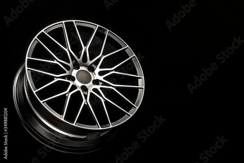 black alloy wheels, aluminum disc sport with a carbon fiber cover. Light weight and modern cool design. copy space maket