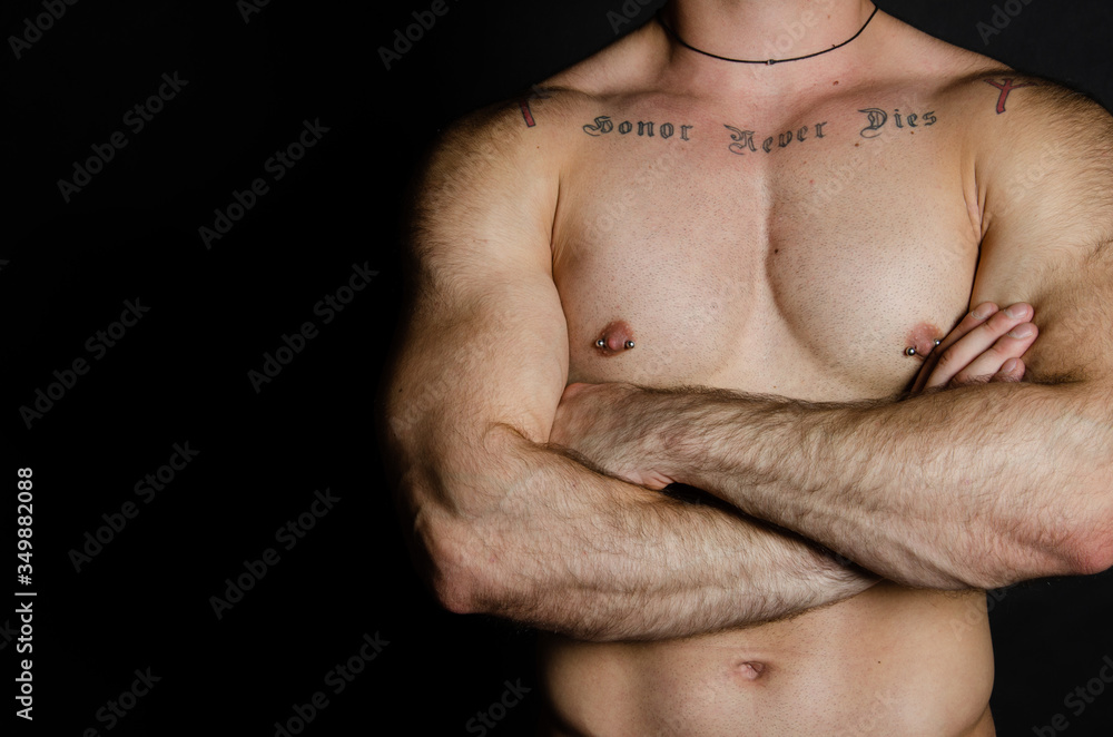 Naklejka premium Young attractive man. Sport and healthy lifestyle. Strong arms.