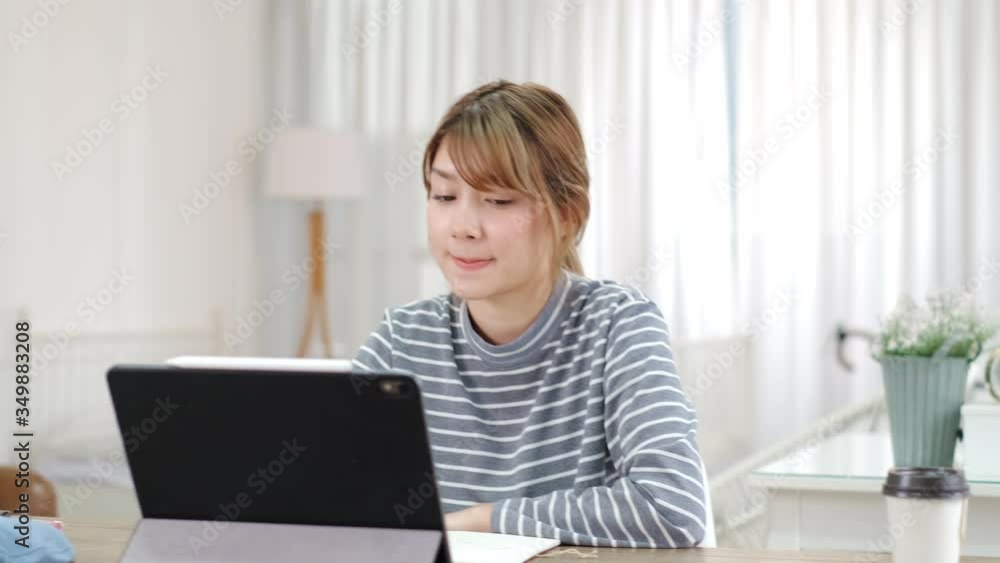 Online Group Video Call Conference of Work Team from Home Office.Smiling young asian woman blogger vlogger influencer sit at home speaking.online with internet teacher learn language talk .young woman Online Group Video Call Conference of Work Team from Home Office.Smiling young asian woman blogger vlogger influencer sit at home speaking.online with internet teacher learn language talk .young woman