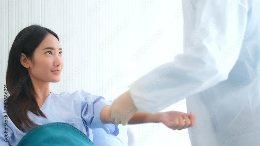 Female doctor talking to patient.doctor with syringe doing injection of vaccine to female patient . Medicine and health care concept. Protect corona virus ,covid19 Female doctor talking to patient.doctor with syringe doing injection of vaccine to female patient . Medicine and health care concept. Protect corona virus ,covid19