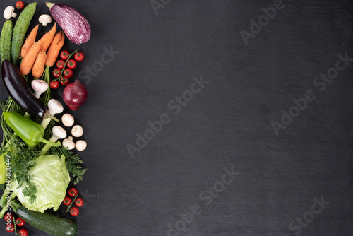 Healthy food clean eating selection: vegetable, superfood, leaf vegetable on black background. copy space. top view.