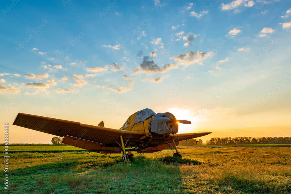 Small yellow airplane at the sunset. Small yellow airplane at the sunset.