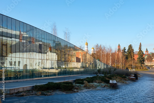 The Zaryadye Park. Varvarka Street. The Varvarinskaya Church, the old English courtyard and the Moscow Kremlin reflected in a glass facade of the house 6, Building 1 photo