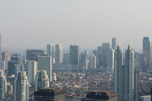 Jakarta  Indonesia - October 20  2019  General aerial view of the skyline of the city of Jakarta  the capital of Indonesia  Java island  submerged by the dense smoke of pollution and the haze. 