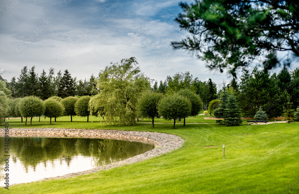 beautiful landscape Park with a small pond on a Sunny day beautiful landscape Park with a small pond on a Sunny day