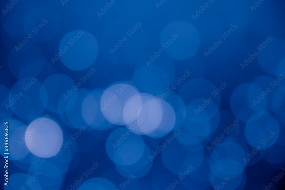 Blue dark bokeh circles defocus glitter blur background. Bokeh abstract background. Blue dark bokeh circles defocus glitter blur background. Bokeh abstract background.