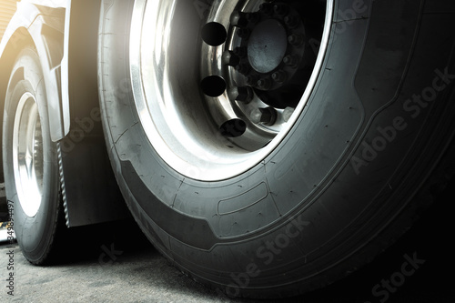 closeup truck wheels and tire of semi truck, industry road transport