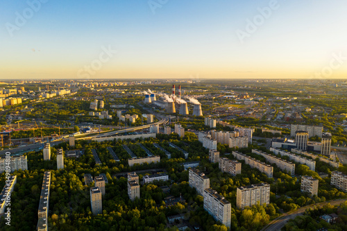 urban landscapes with houses and parks at sunset filmed from a drone