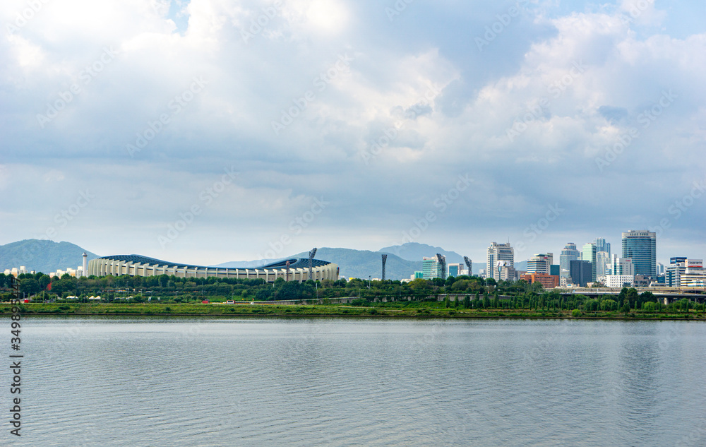 Seoul or Jamsil Olympic Stadium  built for the 1988 Summer Olympics and the 10th Asian Games in 1986, view across Han river.
