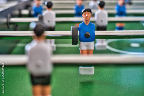Isolated table fotball figure after hitting the ball