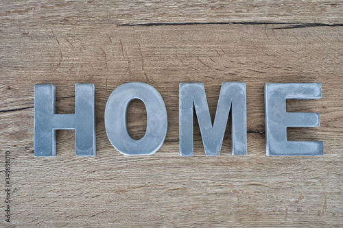 Grey home sign on the wooden desk