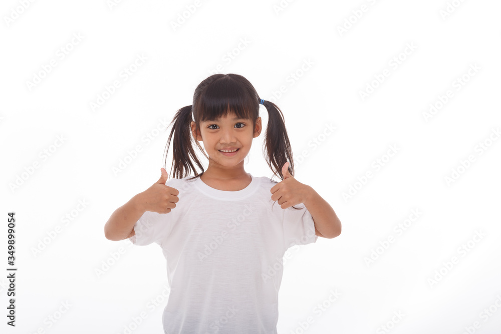 Little asian girl wearing mask for protect pm2.5 and show thumbs up gesture for good air outdoor.Air pollution pm2.5 and Coronavirus concept Little asian girl wearing mask for protect pm2.5 and show thumbs up gesture for good air outdoor.Air pollution pm2.5 and Coronavirus concept