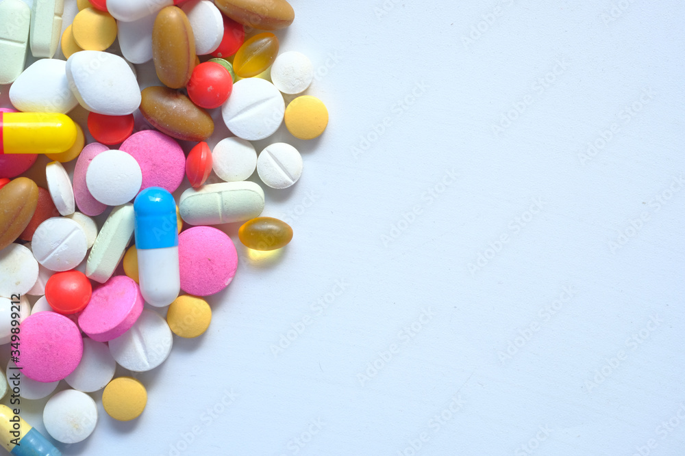 colorful pills on white background with copy space colorful pills on white background with copy space