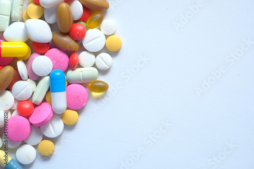colorful pills on white background with copy space 