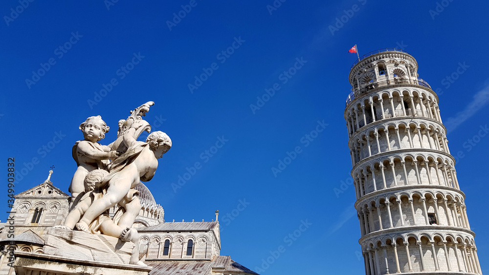 View of an ancient sculpture in front of the Pisa Cathedral (Duomo di Pisa) in Pisa, Italy. It is located in Miracoli Square (Piazza dei Miracoli).