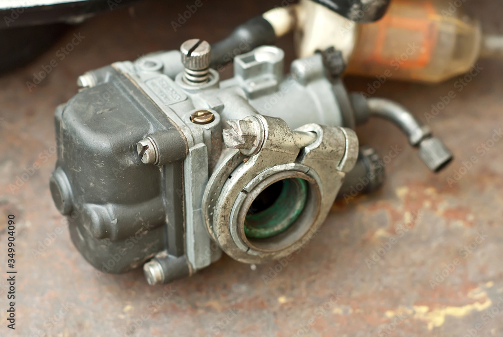 Disassembled engine from a motorcycle close up. Repair and maintenance of old spare parts. Disassembled engine from a motorcycle close up. Repair and maintenance of old spare parts.