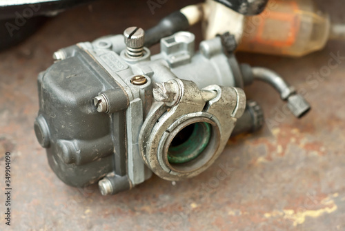 Disassembled engine from a motorcycle close up. Repair and maintenance of old spare parts.