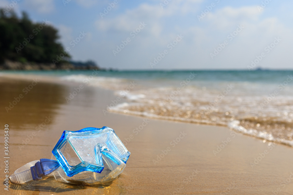 The swimming mask on the sandy beach. Scuba diving. The swimming mask on the sandy beach. Scuba diving.