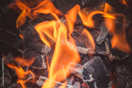 Burning bright flames of coal in hot brazier after arson for frying meat kebabs.