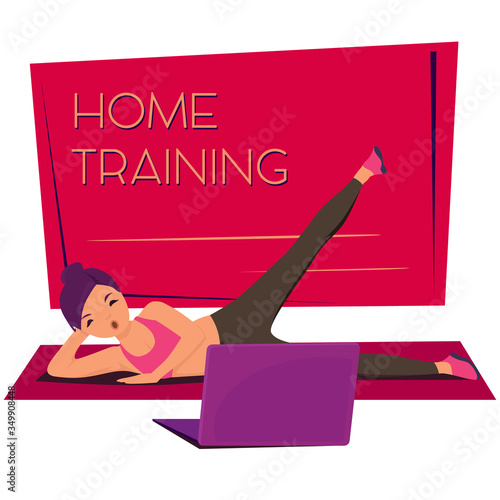 Beautiful sporty woman in tight sportswear doing workout while watching training video