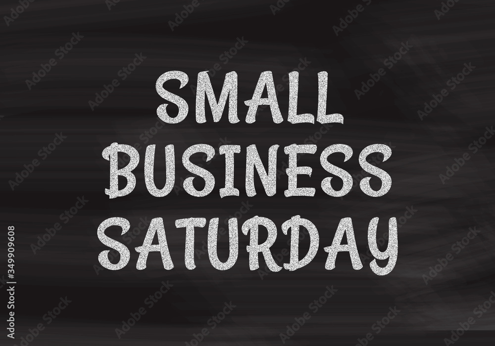 Small Business Saturday written in white chalk on a black chalkboard Small Business Saturday written in white chalk on a black chalkboard