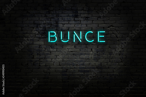 Neon sign with inscription bunce against brick wall photo