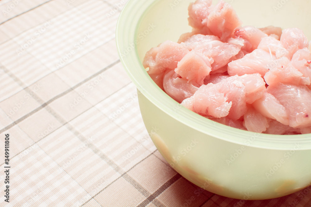 Small pieces of raw chicken in green eggplant for pickling. Small pieces of raw chicken in green eggplant for pickling.
