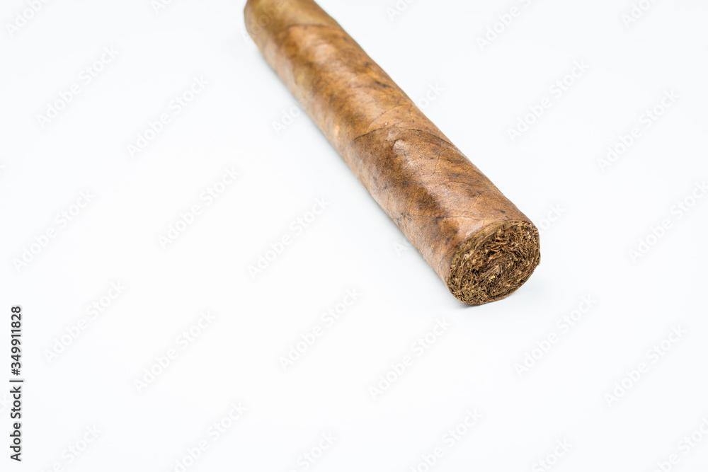 Good thick cigar from twisted sheets on white background. Good thick cigar from twisted sheets on white background.
