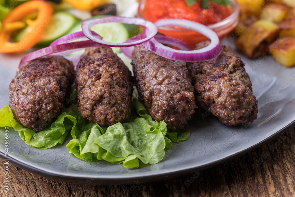 closeup of cevapcici on a plate closeup of cevapcici on a plate