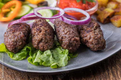 closeup of cevapcici on a plate