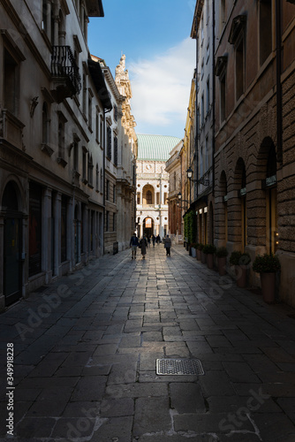 Vicenza, in the afternoon the street called Contra del Monte is completely in the shade, while the Palladian Basilica is illuminated. This condition creates an interesting depth effect. Italy.