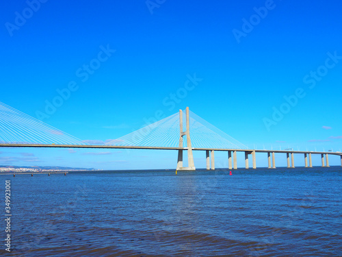 View of the Vasco da Gama Bridge and the Tagus River near the Park of the Nations (Parque das Nações) in Lisbon, Portugal.