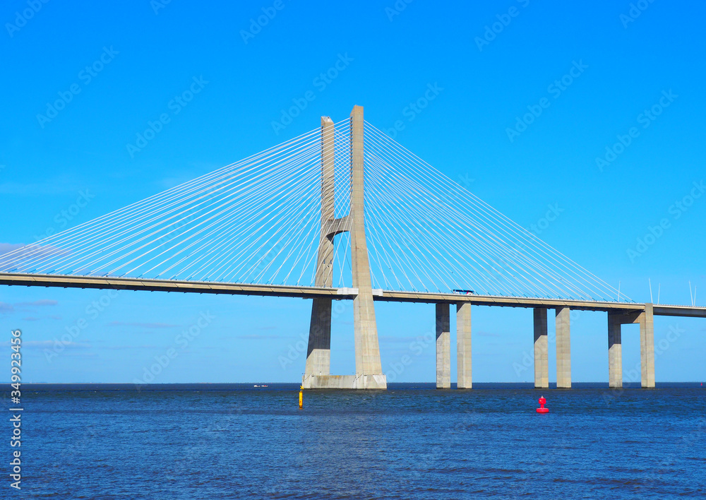 Obraz premium View of the Vasco da Gama Bridge and the Tagus River near the Park of the Nations (Parque das Nações) in Lisbon, Portugal.