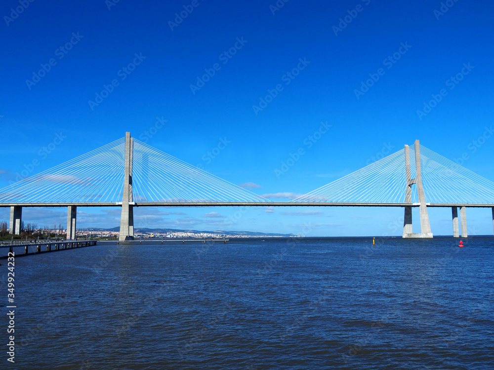 View of the Vasco da Gama Bridge and the Tagus River near the Park of the Nations (Parque das Nações) in Lisbon, Portugal.