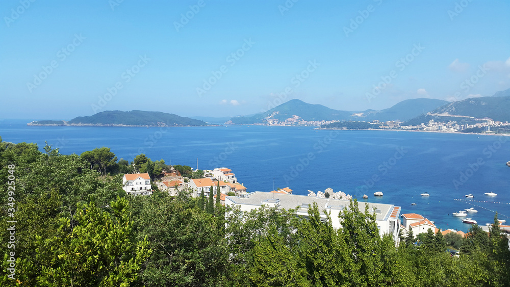 blue Adriatic sea and green hills near Budva and Becici - resort of Montenegro