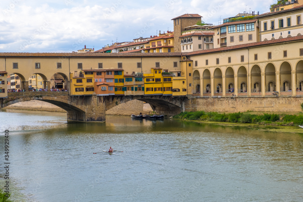 Fototapeta premium View of the bridge Ponte Vecchio and a Vasari Corridor in Florence, Tuscany, Italy