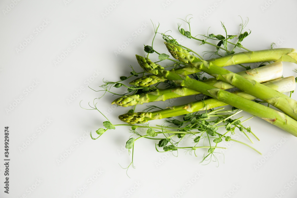 Fototapeta Fresh asparagus with green beans isolated on a white background.