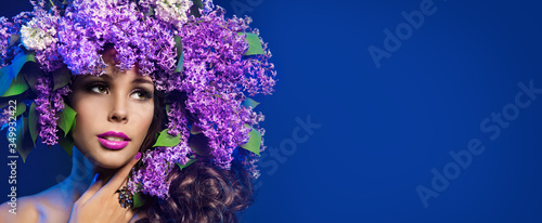 Woman Lilac Flower Wreath Hat, Beautiful Fashion Models with Purple Flowers in Hairstyle on Blue photo
