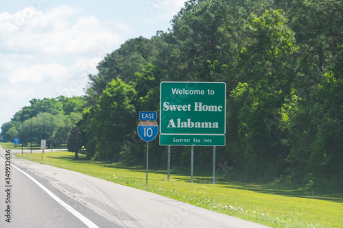 Wallpaper Mural Highway road in Alabama and Mississippi border state welcome sign and text on street on interstate i10 in Grand Bay, AL Torontodigital.ca