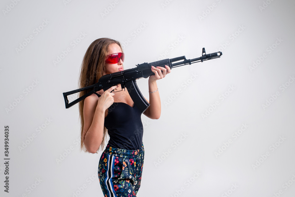 Special agent woman with a black automatic gun