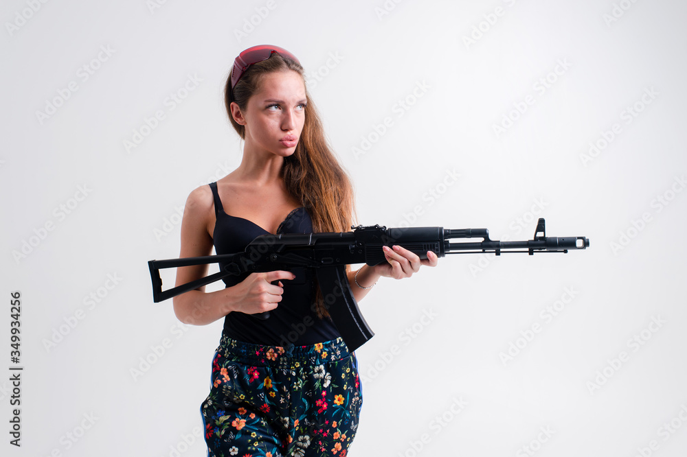 Special agent woman with a black automatic gun Special agent woman with a black automatic gun