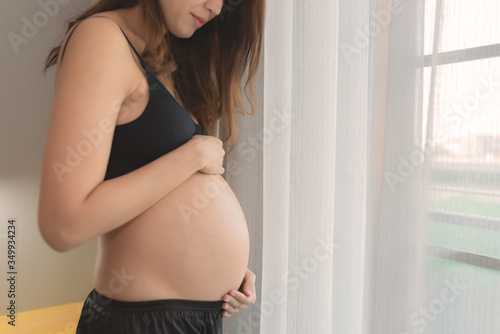 Portrait of asian pregnant woman in the bedroom Free Download Portrait of asian pregnant woman in the bedroom - GFXLoad