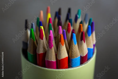 colored pencils in a round tube