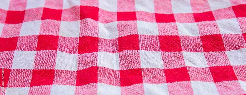 Checkered cloth texture. Red and white squares on textile.