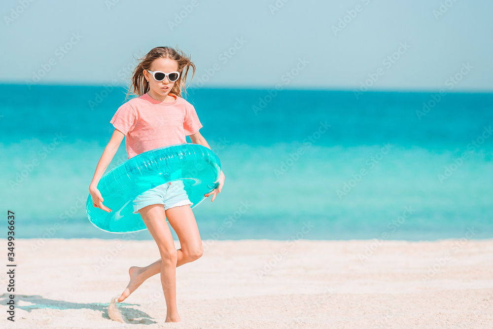Cute little girl at beach during caribbean vacation Cute little girl at beach during caribbean vacation