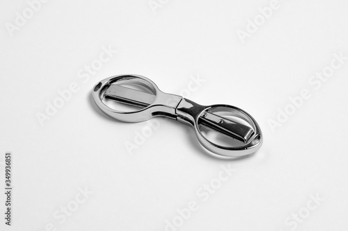 Folding scissors (folded mode) with a white background.High-resolution photo.