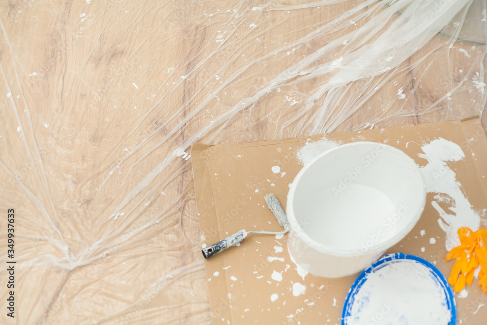 custom made wallpaper toronto digitalAlmost empty paint bucket surrounded by paint blobs and paint residues on painter's film and cardboard Paint roller Latex gloves Handicraft training Apartment renovation Parquet floor