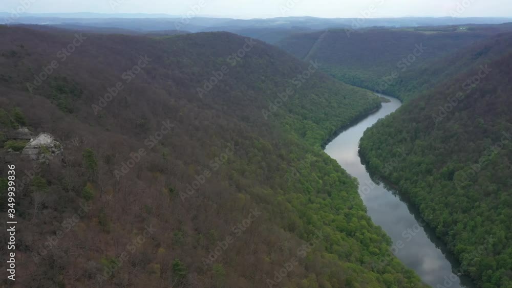 Aerial view trucking to the left and turning keeping the Coopers Rock overlook with panoramic views of the surrounding mountains and river. Aerial view trucking to the left and turning keeping the Coopers Rock overlook with panoramic views of the surrounding mountains and river.