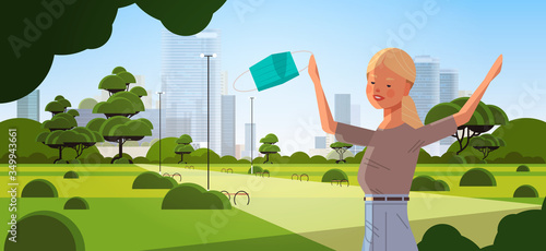 woman holding medical mask coronavirus win defeated covid-19 girl celebrating victory over nCoV virus ending pandemic quarantine concept cityscape background horizontal portrait vector illustration