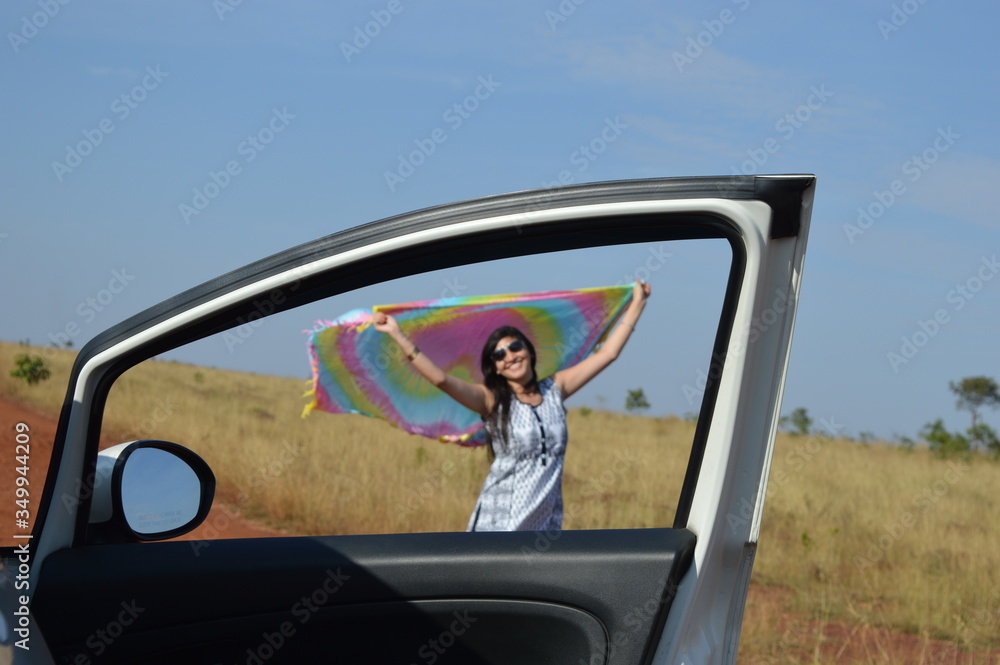 Indian woman posing happy with flying scarf dupata sunglasses smile Indian woman posing happy with flying scarf dupata sunglasses smile